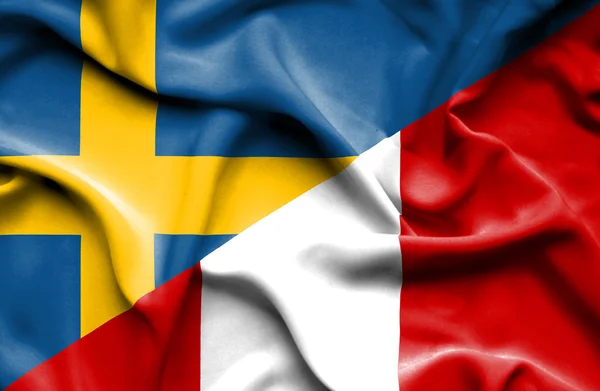 Macha flagą peru i Szwecji — Zdjęcie stockowe