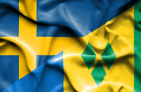 Mávání vlajkou Svatý Vincenc a Grenadiny a Švédska — Stock fotografie