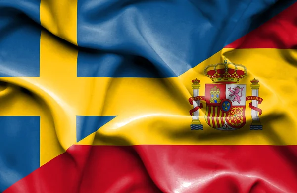 Mávání vlajkou Španělska a Švédska — Stock fotografie