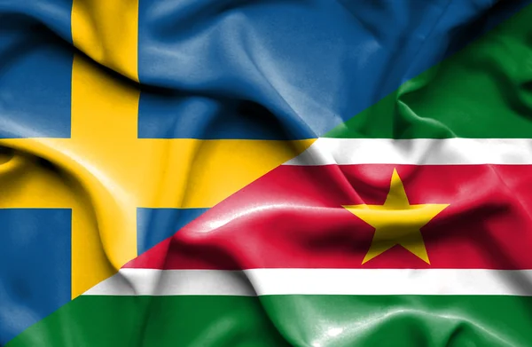 Waving flag of Suriname and Sweden — Stock Photo, Image