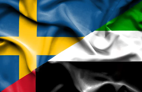 Flagge der Vereinigten Arabischen Emirate und Schwedens schwenken — Stockfoto