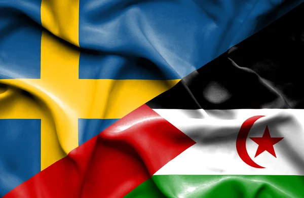 Mávání vlajkou Západní Sahary a Švédska — Stock fotografie