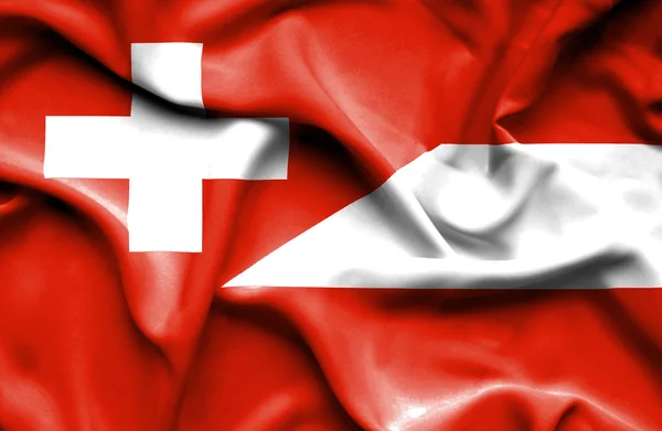 Waving flag of Austria and Switzerland — Stock Photo, Image