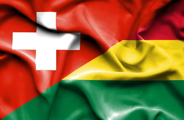 Bolivya ve İsviçre bayrağı sallayarak — Stok fotoğraf