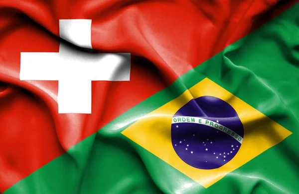 Waving flag of Brazil and Switzerland — Stock Photo, Image