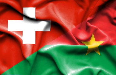 burkina faso ve İsviçre bayrağı sallayarak