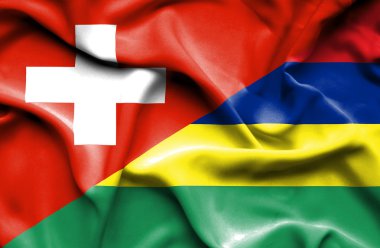 mauritius ve İsviçre bayrağı sallayarak