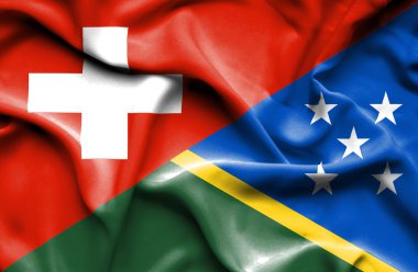 solomon Adaları ve İsviçre bayrağı sallayarak