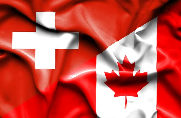 Waving flag of Canada and Switzerland — Stock Photo, Image