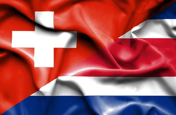 Wapperende vlag van costa rica en Zwitserland — Stockfoto