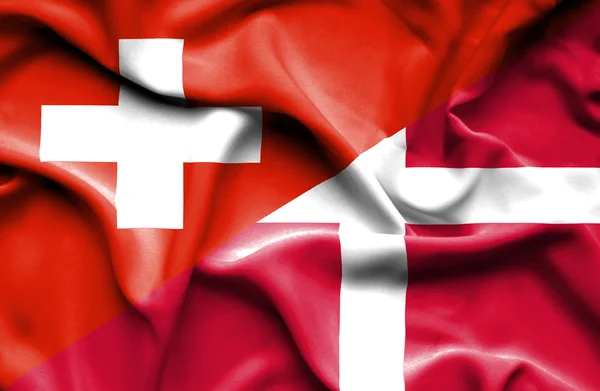 Bandeira ondulada da Dinamarca e Suíça — Fotografia de Stock