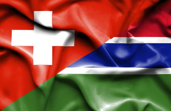 Sventolando bandiera di Gambia e Svizzera — Foto Stock