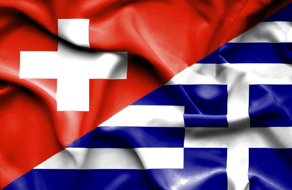 Yunanistan ve İsviçre bayrağı sallayarak — Stok fotoğraf