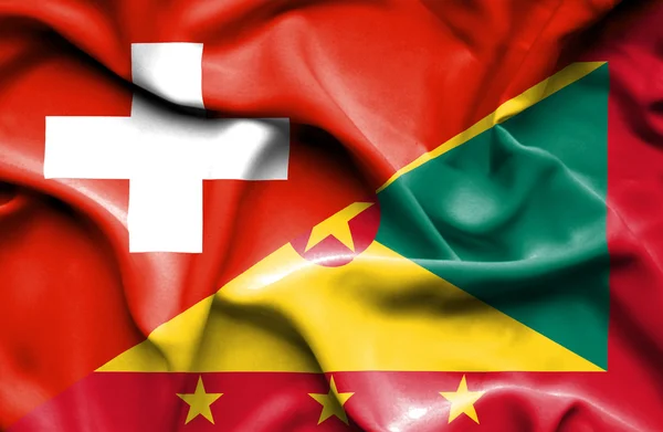 Bandera ondeante de Guernsey y Suiza —  Fotos de Stock