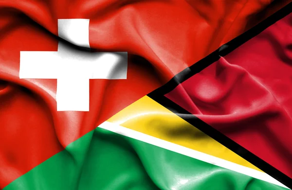 Sventolando bandiera della Guyana e della Svizzera — Foto Stock