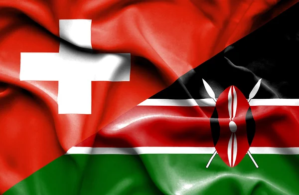 ケニア、スイス連邦共和国の旗を振っています。 — ストック写真