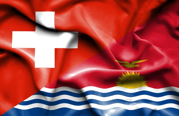 Vlající vlajka kiribati a Švýcarskem — Stock fotografie