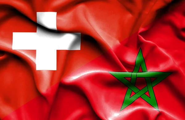 Flagge Marokkos und der Schweiz schwenken — Stockfoto
