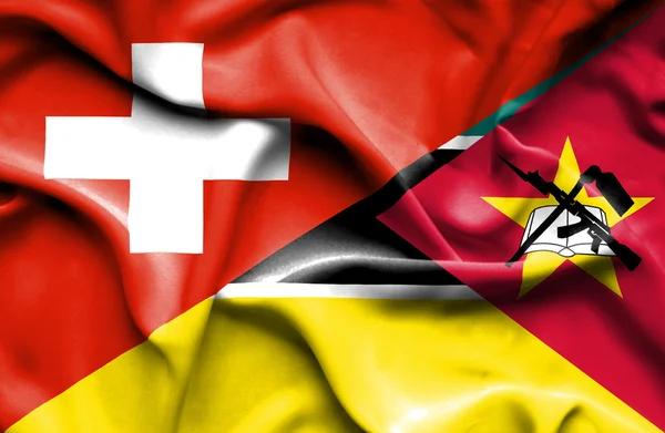 Wapperende vlag van mozambique en Zwitserland — Stockfoto