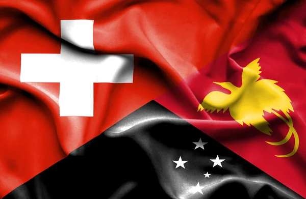 Bandera ondeante de Papúa Nueva Guinea y Suiza — Foto de Stock