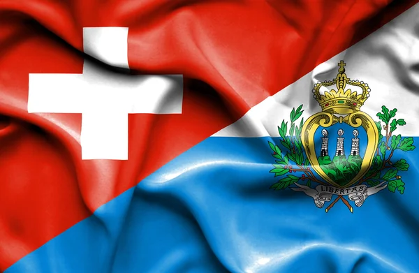 San marino ve İsviçre bayrağı sallayarak — Stok fotoğraf