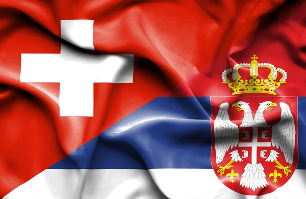 Bandera ondeante de Serbia y Suiza —  Fotos de Stock