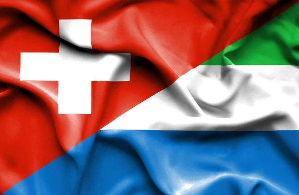 Bandera ondeante de Sierra Leona y Suiza — Foto de Stock