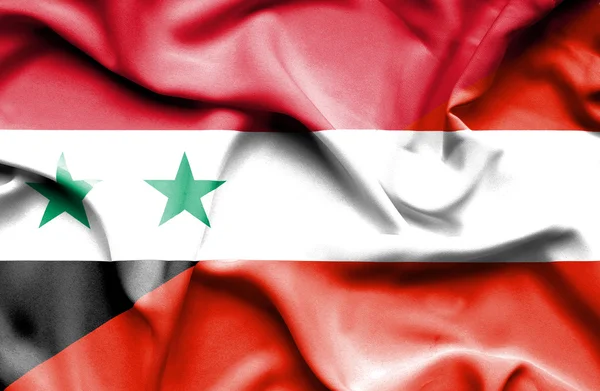 Wapperende vlag van Oostenrijk en Syrië — Stockfoto