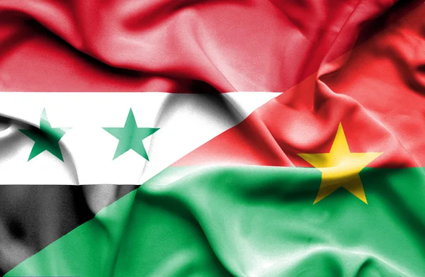 Wapperende vlag van burkina faso en Syrië — Stockfoto