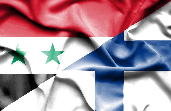 Wapperende vlag van finland en Syrië — Stockfoto