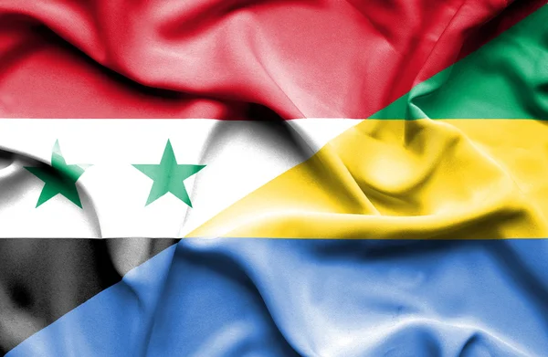 Wapperende vlag van gabon en Syrië — Stockfoto