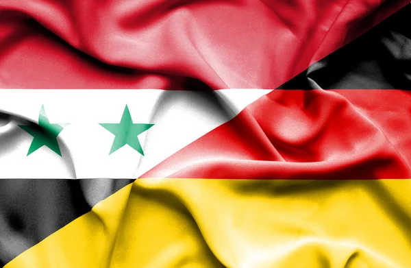 Waving flag of Germany and Syria — Stock Photo, Image