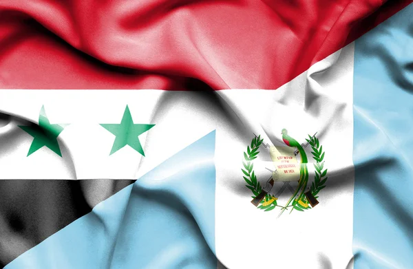 Machać flaga Gwatemali i syria — Zdjęcie stockowe