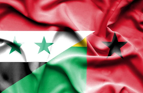 Guinea-Bissau och Syrien viftande flagga — Stockfoto