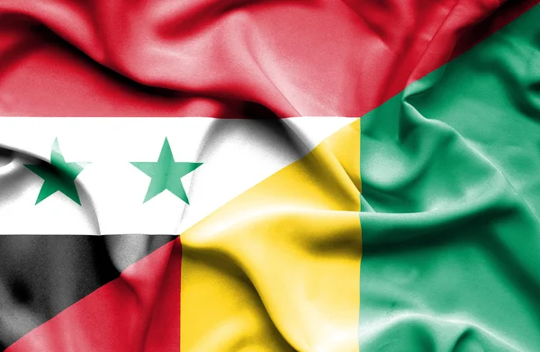 Waving flag of Guinea and Syria — Stock Photo, Image