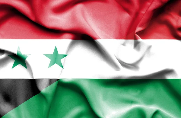 Waving flag of Hungary and Syria — Stock Photo, Image