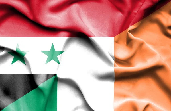 Waving flag of Ireland and Syria — Stock Photo, Image