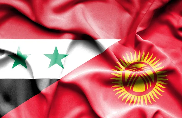 Waving flag of Kyrgyzstan and Syria — Stock Photo, Image