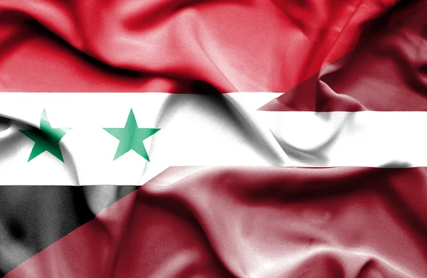 Wapperende vlag van Letland en Syrië — Stockfoto