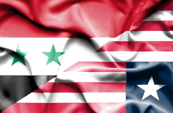 利比里亚和叙利亚那飘扬的旗帜 — 图库照片