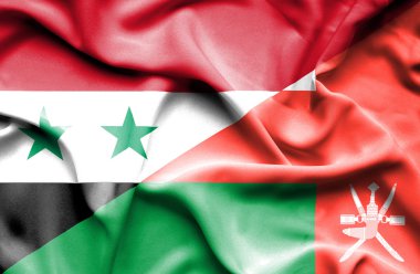 Umman ve Suriye bayrağı sallayarak