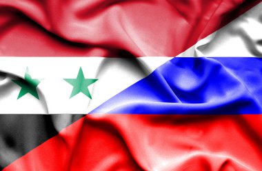 Rusya ve Suriye bayrağı sallayarak