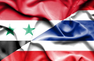 Tayland ve Suriye bayrağı sallayarak