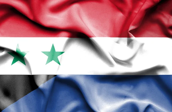 Wapperende vlag van Nederland en Syrië — Stockfoto