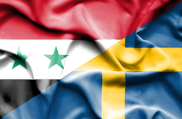 Flagge Schwedens und Syriens schwenken — Stockfoto