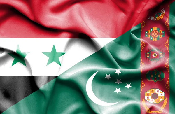 Waving flag of Turkmenistan and Syria — Stock Photo, Image