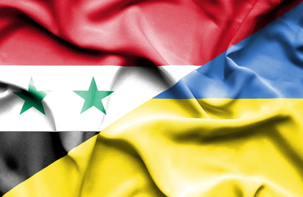 Viftande flagga Ukraina och Syrien — Stockfoto