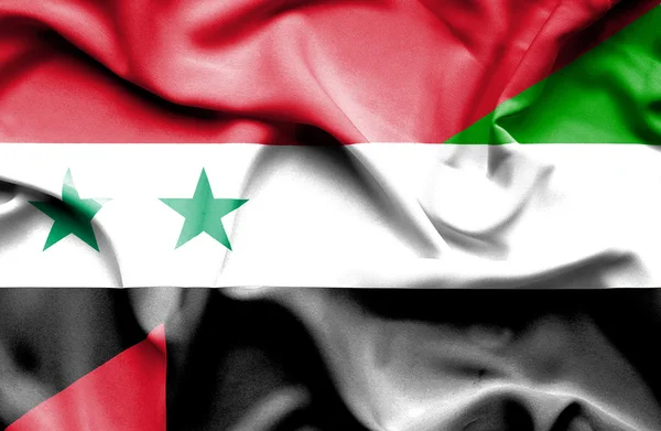 Wapperende vlag van Verenigde Arabische Emiraten en Syrië — Stockfoto