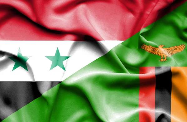 Waving flag of Zimbabwe and Syria — Stock Photo, Image