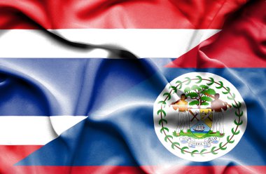 belize ve Tayland bayrağı sallayarak